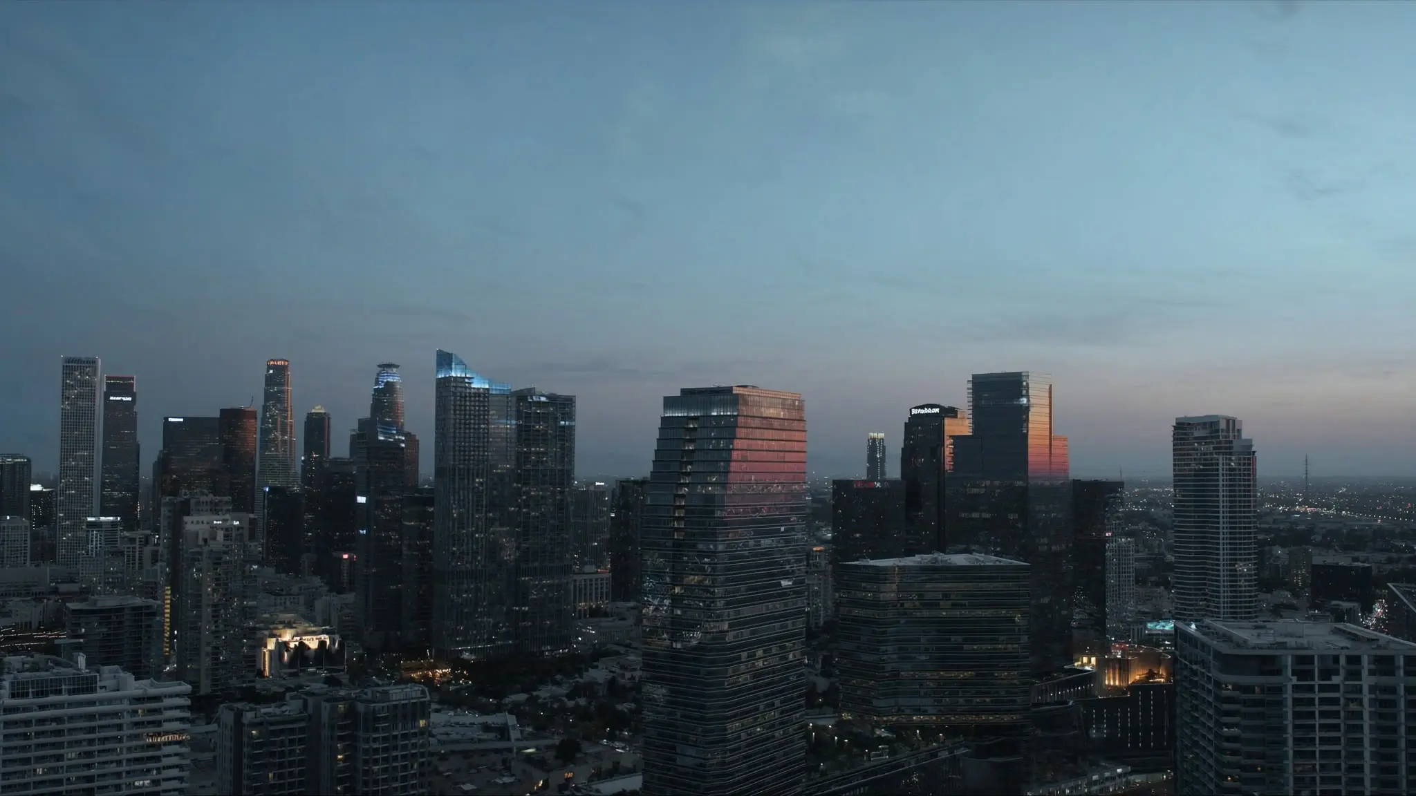 Century City's glass towers catching the sunset above the Westside