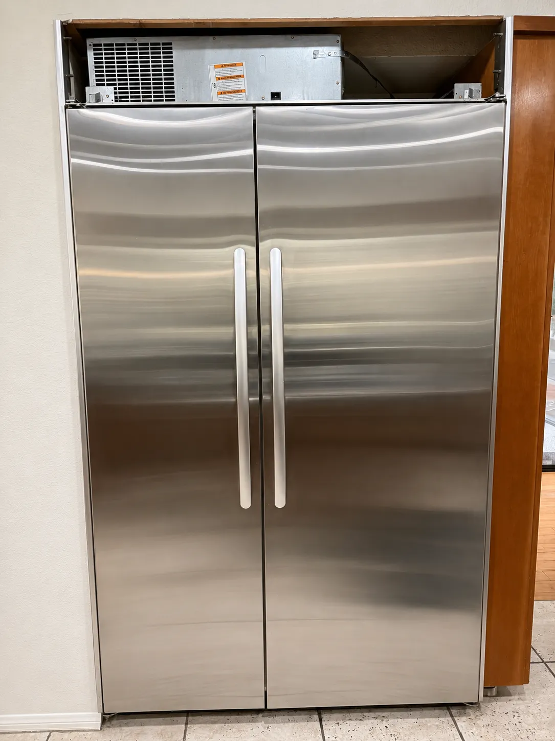 Open refrigerator interior stocked with fresh food