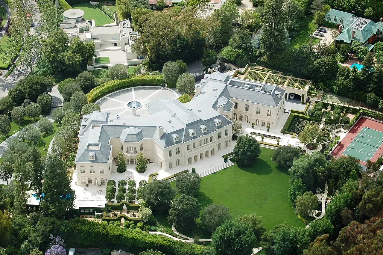 French-style Holmby Hills estate with formal gardens, pool, and tennis court from above