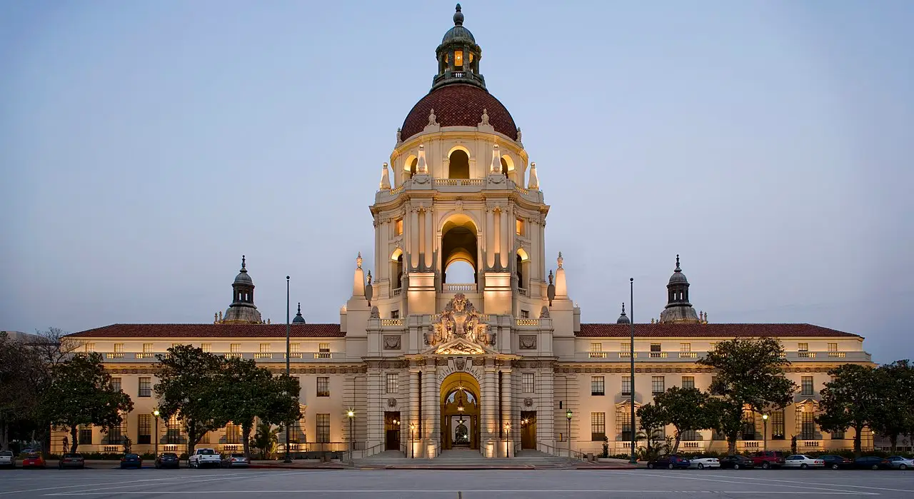 Pasadena City Hall's domed tower floodlit at dusk