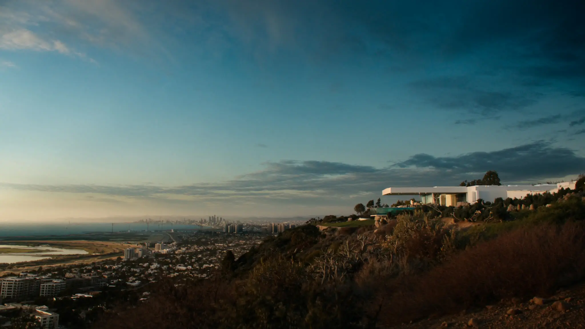 Hilltop Playa del Rey home overlooking the Ballona Wetlands and coastline at dusk