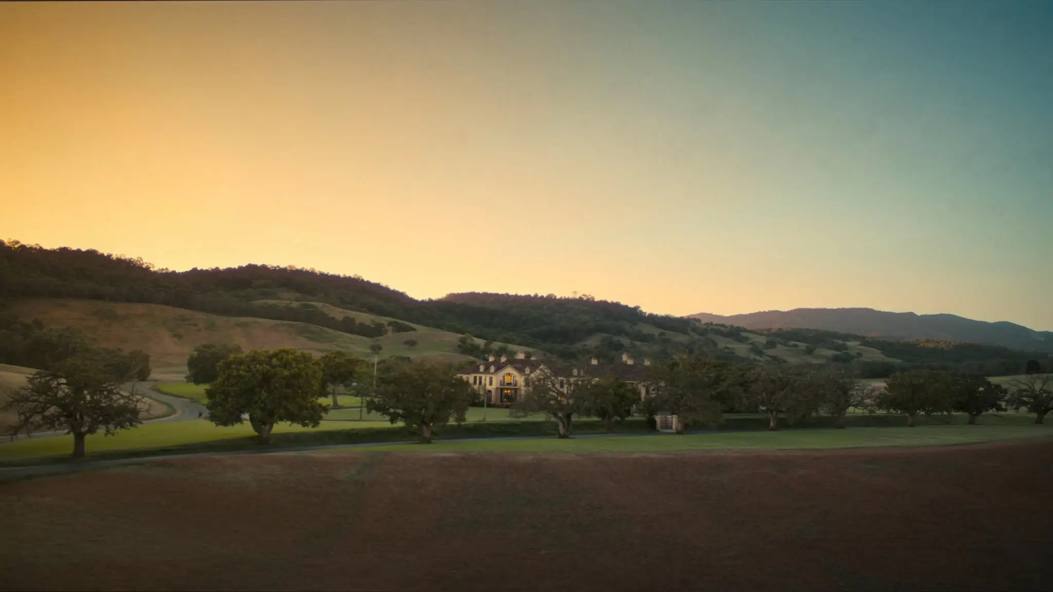 Estate home among the oaks at golden hour beneath Thousand Oaks' rolling hills